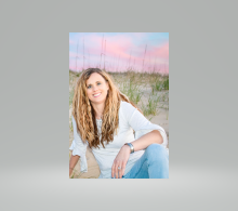 Susan is sitting on the beach at 47th street in Virginia Beach where she lived for 28 years.