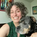 Makael smiling with her dog, Kai