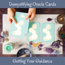 cards being laid out on a table with crystals