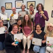 Look what they're holding along with their certificates!