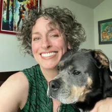 Makael smiling with her dog, Kai